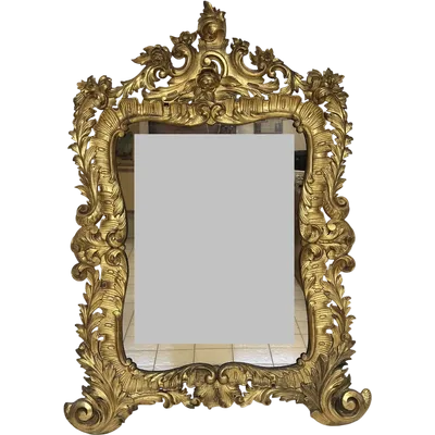 Mirror with carved and gilded wooden frame. Lombardy 18th century