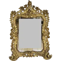 Specchiera con cornice in legno intagliato e dorato. Lombardia XVIII secolo