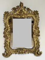 Specchiera con cornice in legno intagliato e dorato. Lombardia XVIII secolo