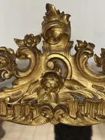 Specchiera con cornice in legno intagliato e dorato. Lombardia XVIII secolo