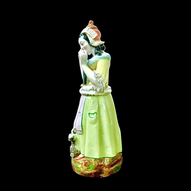 Porcelain veilleuse tisaniera depicting female figure filandera.France.