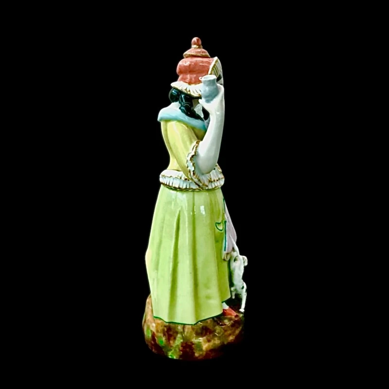 Porcelain veilleuse tisaniera depicting female figure filandera.France.