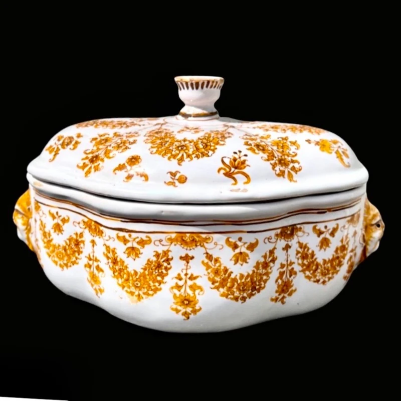 Majolica soup tureen. Decorated with floral motifs and festoons with masked sockets.Moustiers