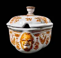 Majolica soup tureen. Decorated with floral motifs and festoons with masked sockets.Moustiers