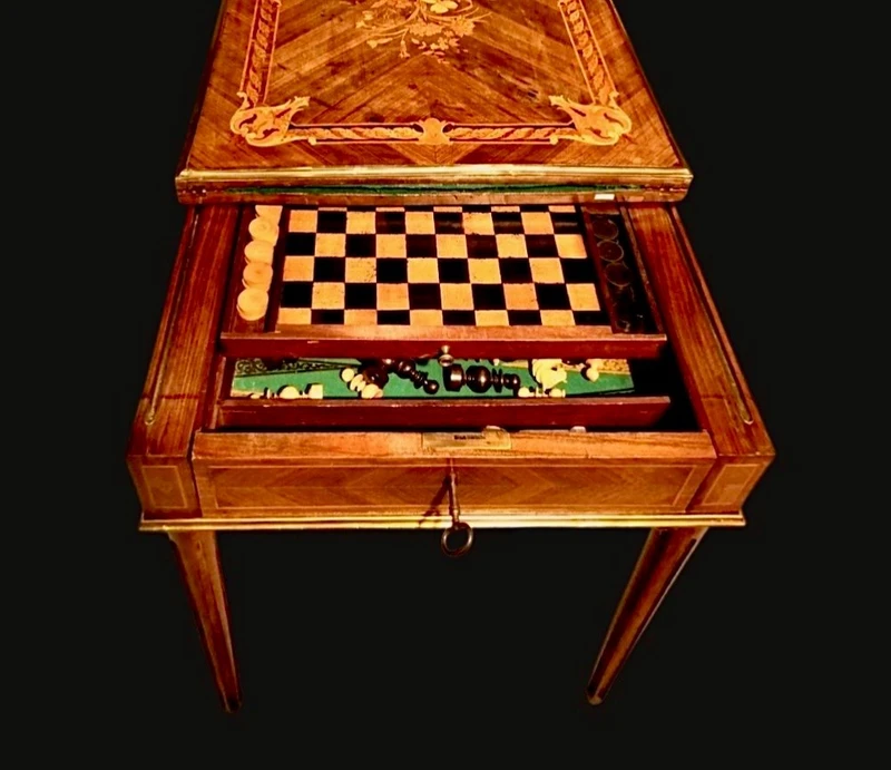 Walnut game table with inlays. The top is sliding and tilting