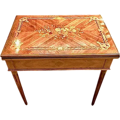 Walnut game table with inlays. The top is sliding and tilting