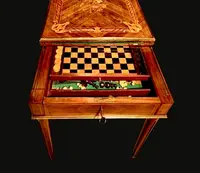 Walnut game table with inlays. The top is sliding and tilting