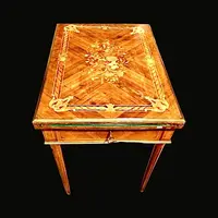 Walnut game table with inlays. The top is sliding and tilting