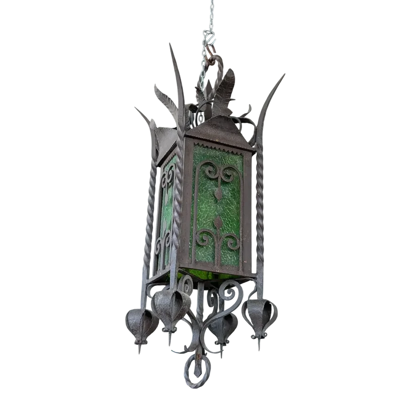 Suspended lantern made of wrought iron and green blown glass