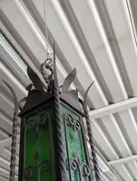 Suspended lantern made of wrought iron and green blown glass