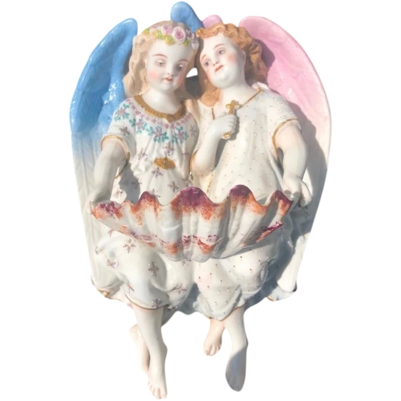 Porcelain bisque stoup with two angels.