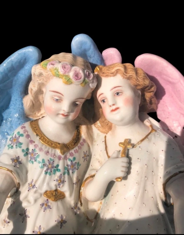 Porcelain bisque stoup with two angels.