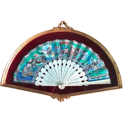 Fan with perforated slats and painted paper peacock.