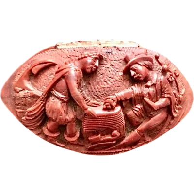 Snuffbox a curozo seed with engraved character scene.