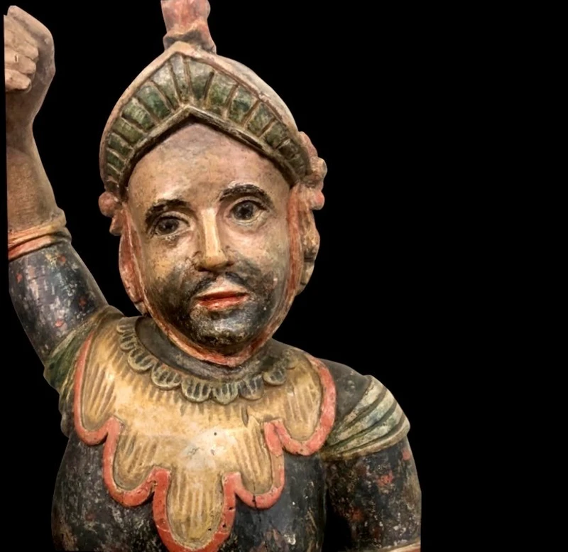 Polychrome wooden sculpture depicting soldier.