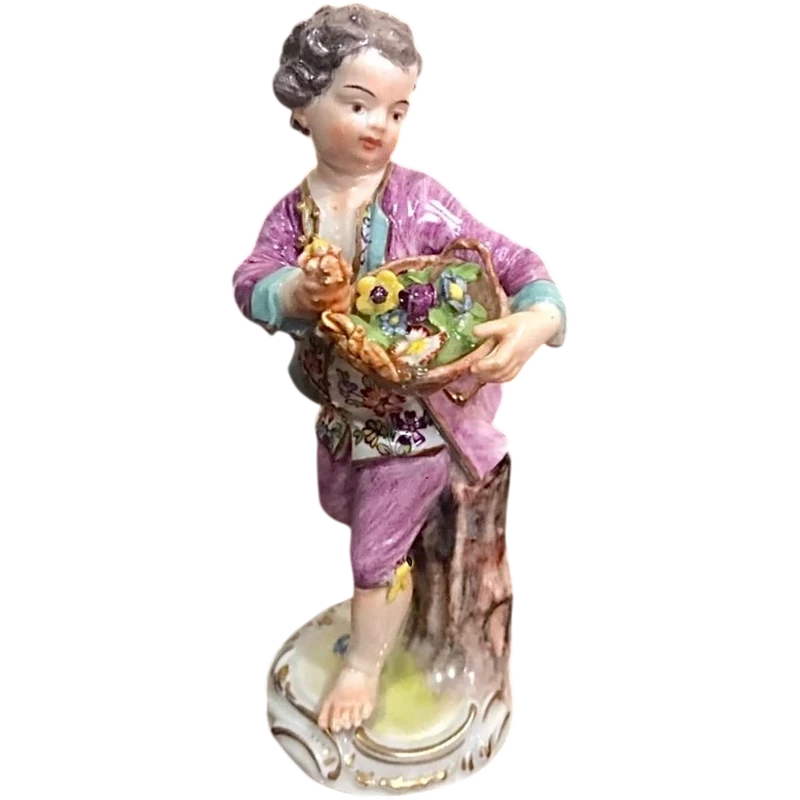 Meissen porcelain figurine,baby with flower basket.