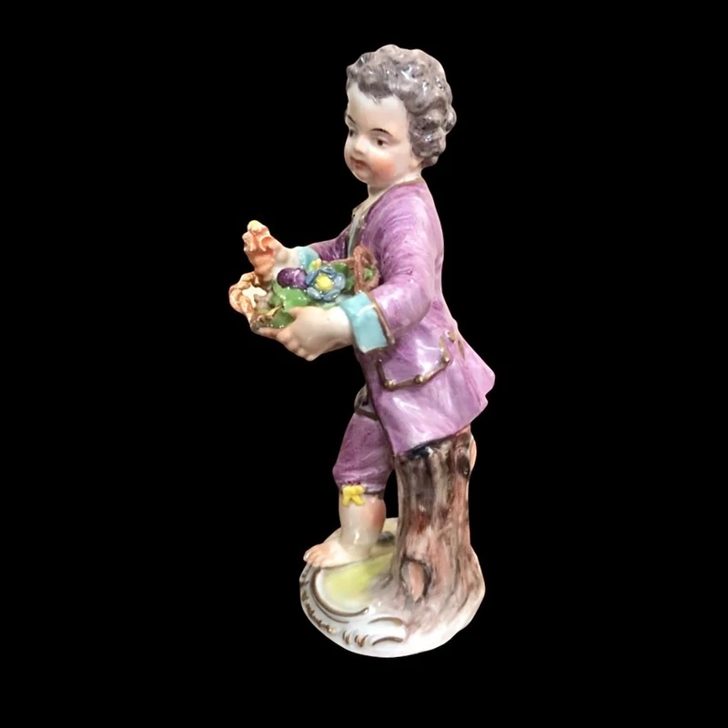 Meissen porcelain figurine,baby with flower basket.