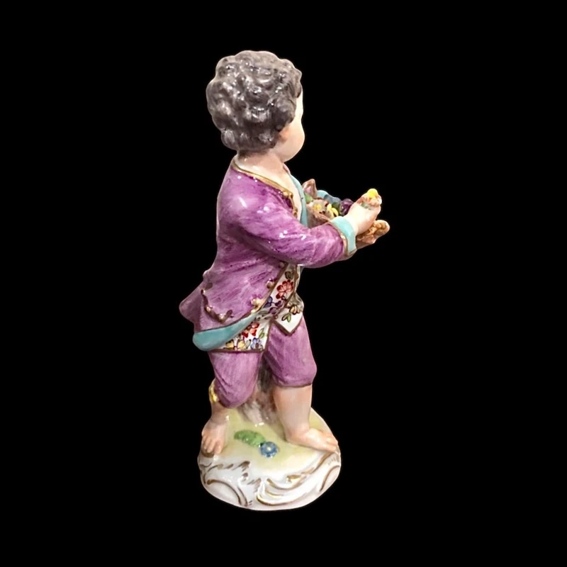 Meissen porcelain figurine,baby with flower basket.