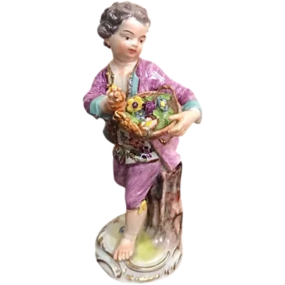 Meissen porcelain figurine,baby with flower basket.