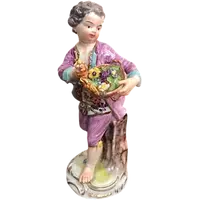 Meissen porcelain figurine,baby with flower basket.