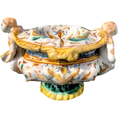 Majolica salt cellar with sockets in the shape of angels holding books and 'Raphaelesque' decoration