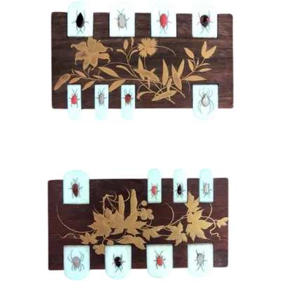 Rosewood marker with gold floral motifs and gemstone insects.Shibayama