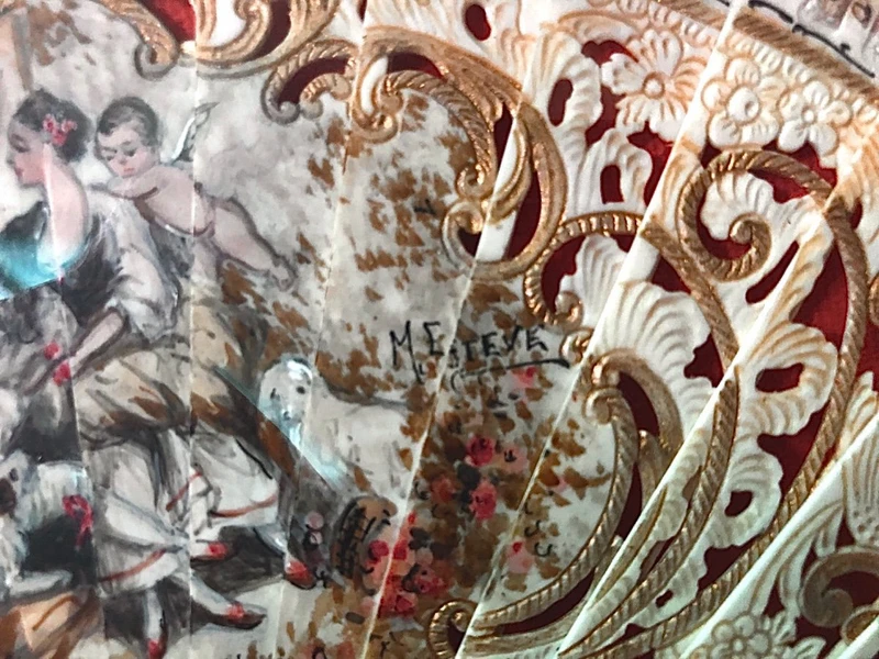 Fan with pierced bone slats with gold highlights and painted gallant scene.France