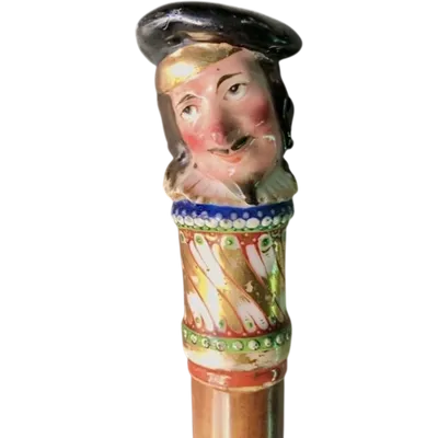 Porcelain pommel cane with male figure and malacca cane.Nymphenburg,Germany,