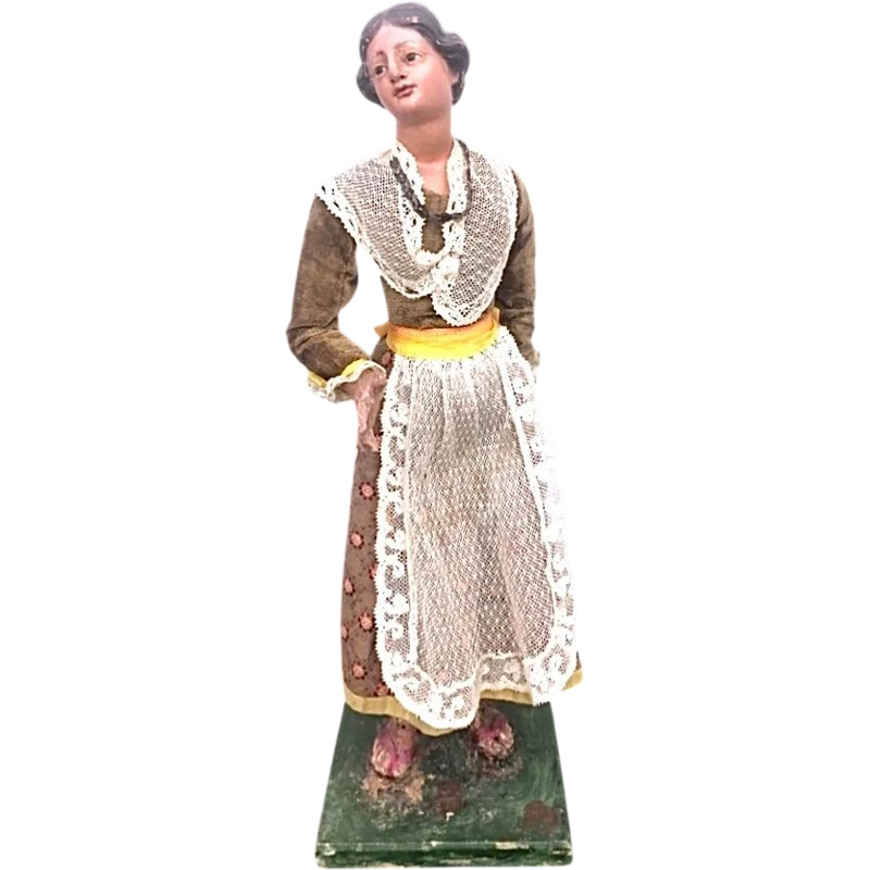Painted wooden nativity scene figurine depicting peasant woman.Genoa.