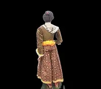Painted wooden nativity scene figurine depicting peasant woman.Genoa.