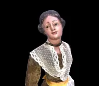Painted wooden nativity scene figurine depicting peasant woman.Genoa.