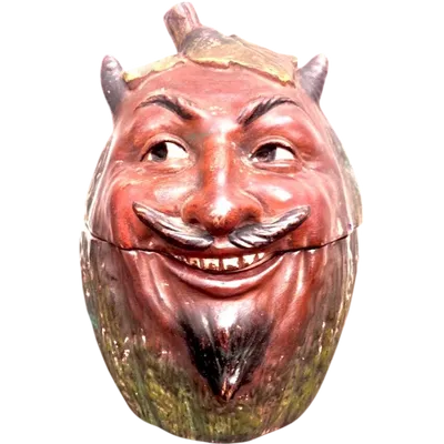 Terracotta snuff box depicting pumpkin in the shape of a smiling Mephistopheles head
