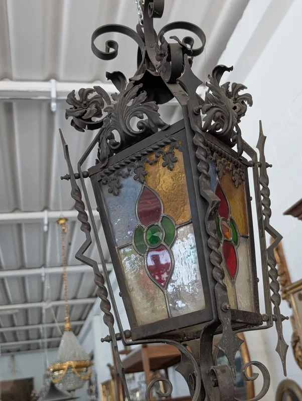 Suspended lantern made of wrought iron and leaded colored glass