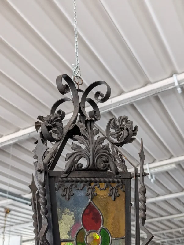 Suspended lantern made of wrought iron and leaded colored glass