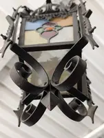 Suspended lantern made of wrought iron and leaded colored glass