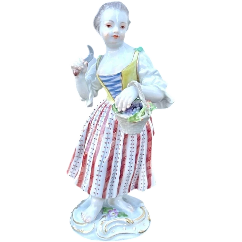 Porcelain sculpture depicting a peasant woman with a sickle. Meissen