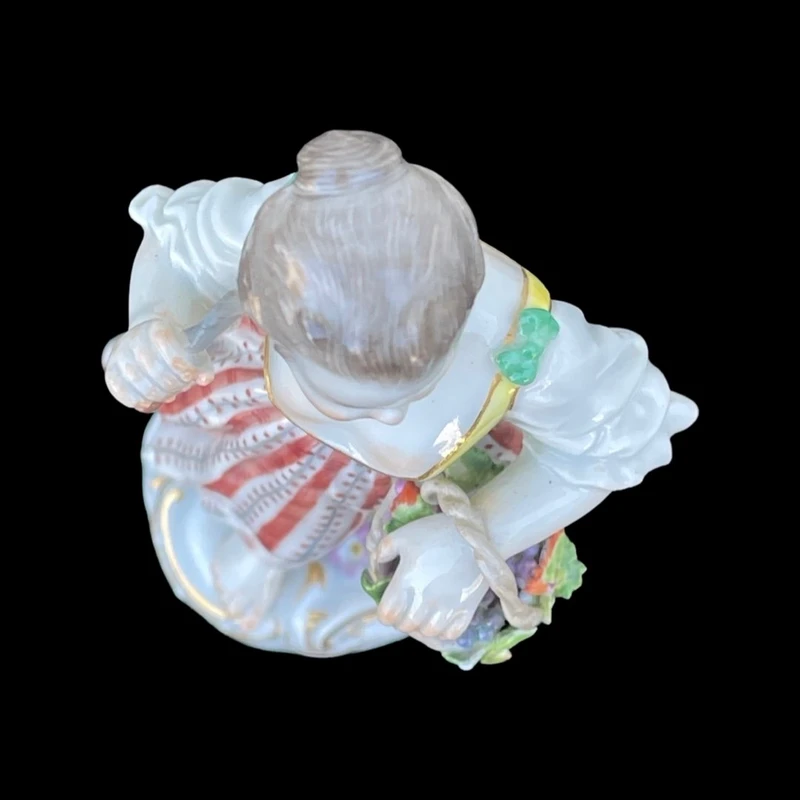 Porcelain sculpture depicting a peasant woman with a sickle. Meissen