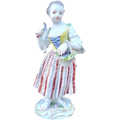 Porcelain sculpture depicting a peasant woman with a sickle. Meissen