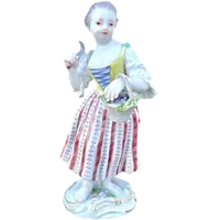 Porcelain sculpture depicting a peasant woman with a sickle. Meissen