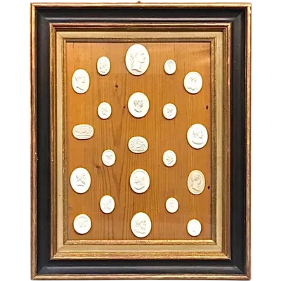 A collection of stucco reliefs based on ancient carvings and cameos featuring the profiles of emperors