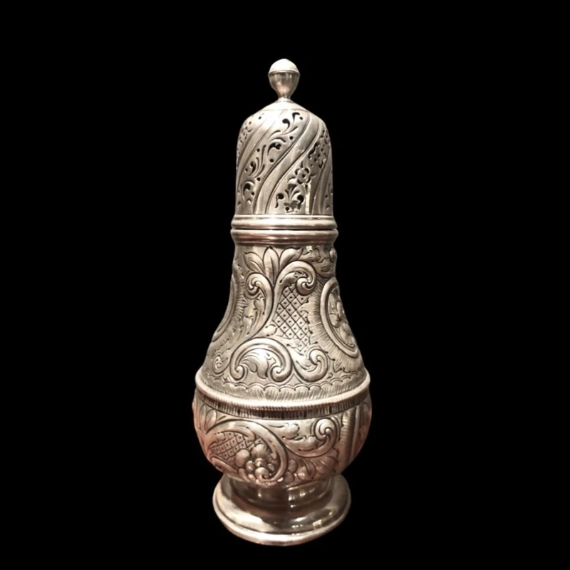Silver sugar shaker featuring animal motifs, seed beads, and a medallion with engraved initials.