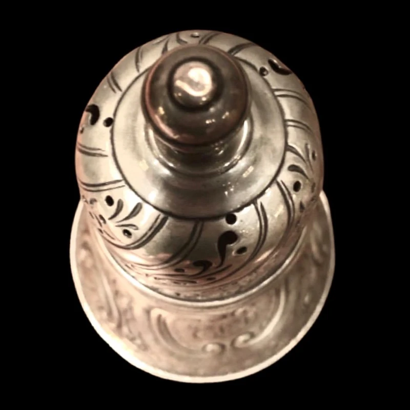 Silver sugar shaker featuring animal motifs, seed beads, and a medallion with engraved initials.