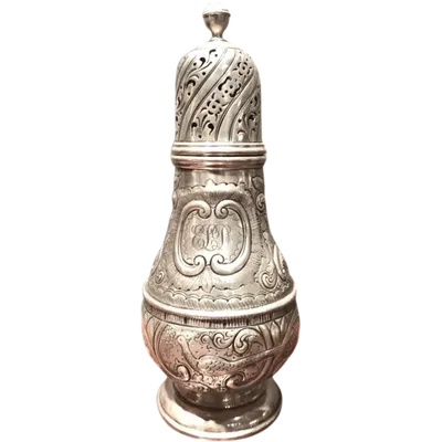 Silver sugar shaker featuring animal motifs, seed beads, and a medallion with engraved initials.