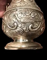 Silver sugar shaker featuring animal motifs, seed beads, and a medallion with engraved initials.