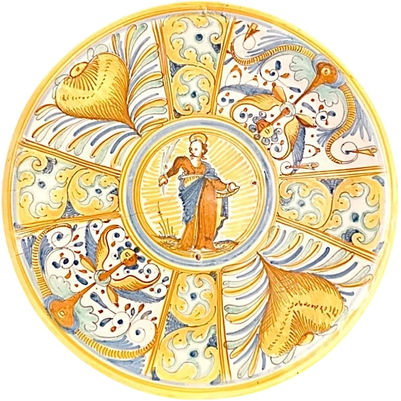 Assiette-planche à découper en faïence, décorée de quartiers à la Raphaël et de motifs végétaux stylisés