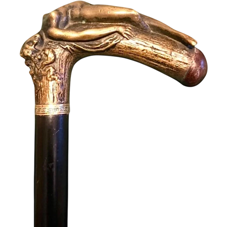 A walking stick with an erotic motif, featuring a bronze handle depicting a reclining nude woman.