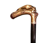 A walking stick with an erotic motif, featuring a bronze handle depicting a reclining nude woman.
