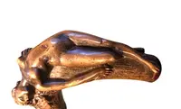 A walking stick with an erotic motif, featuring a bronze handle depicting a reclining nude woman.