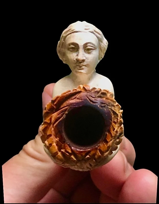 A sea foam pipe featuring an erotic design of a nude woman.