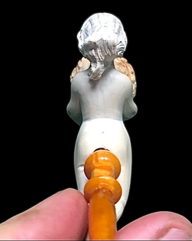 A sea foam pipe featuring an erotic design of a nude woman.